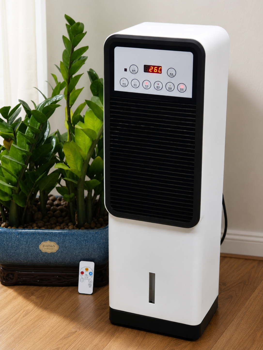 Portable cold and warm air conditioner fan displayed in a home with its remote control